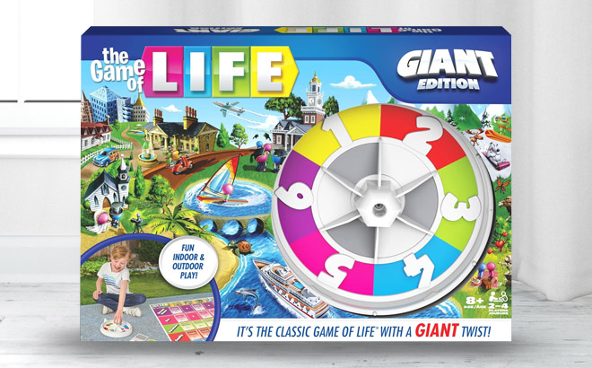 an Image of a The Game of Life Giant Edition Box on a Floor