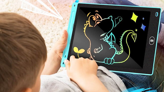 A Boy Using a Magic Doodle Writing Tablet