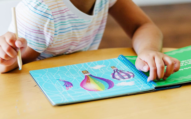 A Girl Doing an Activity on her Melissa Doug Favorite Things Hidden Picture Pad