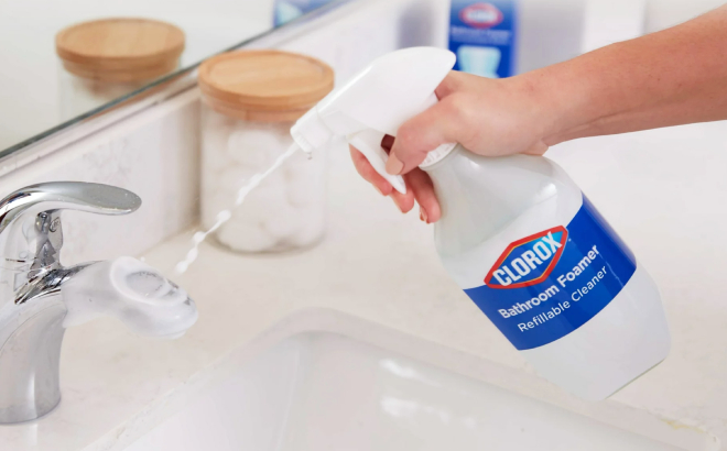 A Person Cleaning a Faucet Using the Clorox Multi Purpose Cleaner System Starter Kit A Person Cleaning a Faucet Using the Clorox Multi Purpose Cleaner System Starter Kit