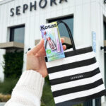 A Person Holding a Kosas Lip Brow Birthday Set Infront of Sephora Store