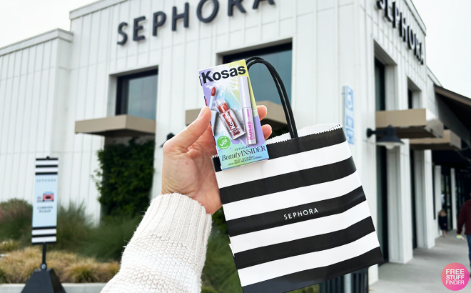 A Person Holding a Kosas Lip Brow Birthday Set Infront of Sephora Store