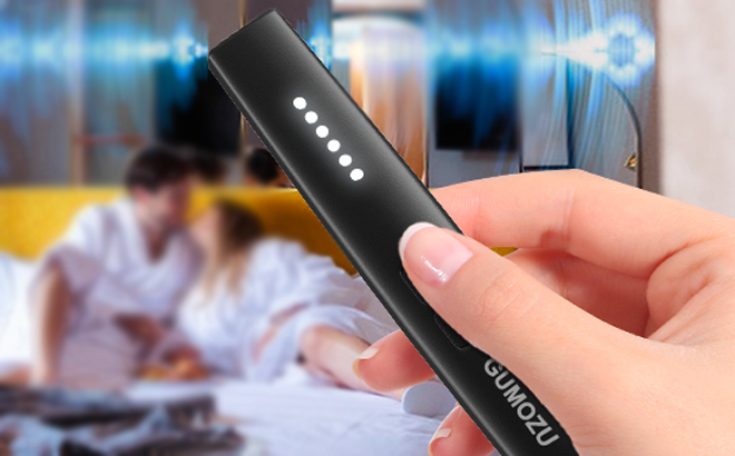 A Person Holidng a Hidden Camera Detector A Person Holidng a Hidden Camera Detector