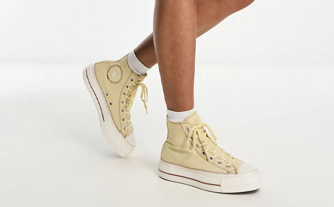 A Person Wearing Converse Chuck Taylor All Star Hi Sneakers
