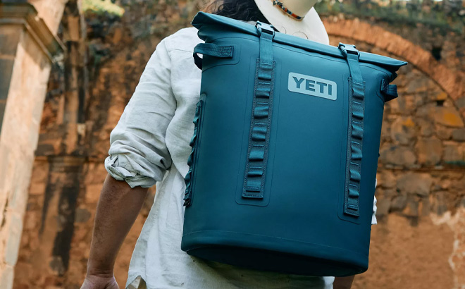 A Person Wearing Hopper M20 Soft Backpack Cooler in Agave Teal Color A Person Wearing Hopper M20 Soft Backpack Cooler in Agave Teal Color