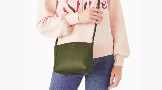 A Person Wearing Kate Spade Monica Crossbody Bag in Green