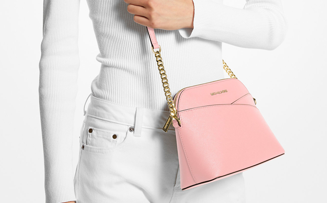 A Person Wearing Pink Michael Kors Crossbody Bag