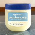 Amazon Basics Petroleum Jelly White Petrolatum Skin Protectant on a Table