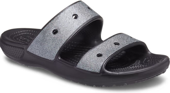 Crocs Classic Glitter Sandals on a Gray Background