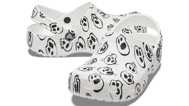 Crocs Kids Classic Seasonal Graphic Clogs in White Black Skull Print