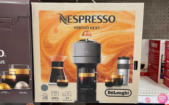 DeLonghi Nespresso Vertuo Next with Stainless Steel Cup Bundle on a Shelf at a Store