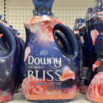Downy Infusions Laundry Fabric Softener Liquid on a Shelf at a Store