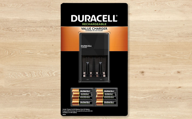 Duracell Ion Speed 1000 Charger with 8 Pack Batteries on a Table