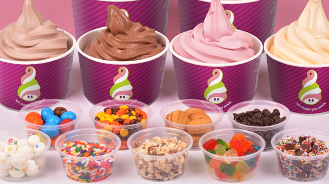 Four Menchies Frozen Yogurt with Various Toppings on a Table