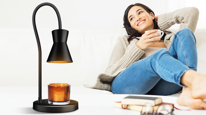 GETOHAN Candle Warmer Lamp on the table with a person holding a cup