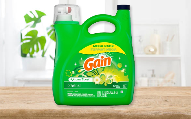 Gain Aroma Boost Original Detergent 107 Count on a Table