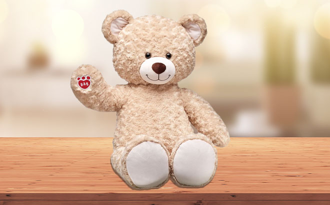 Giant Happy Hugs Teddy Bear on a Table