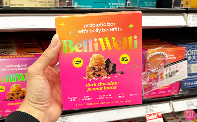Hand Holding BelliWelli Dark Chocolate Peanut Probiotic Bar Box at Target