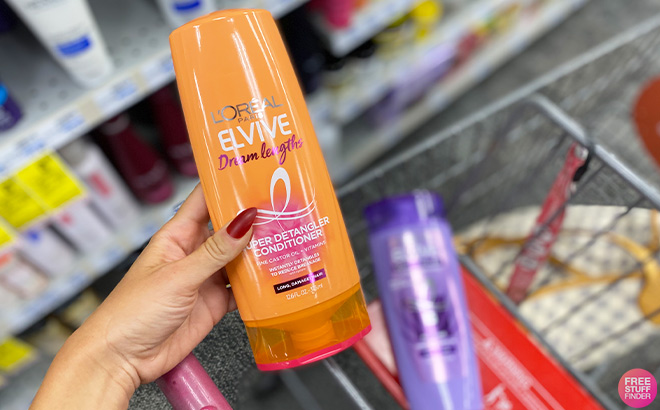 Hand Holding LOreal Elvive Dream Lengths Conditioner