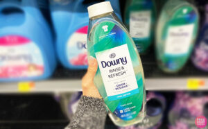 Hand Holding a Downy Rinse Refresh Fabric Softner