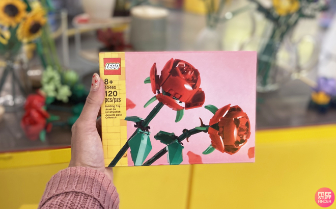 Hand Holding a LEGO Roses Building Kit