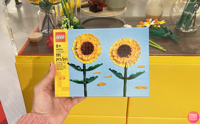 Hand Holding a LEGO Sunflowers Building Kit