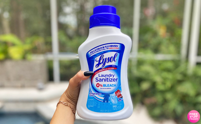 Hand Holding a Lysol Laundry Sanitizer