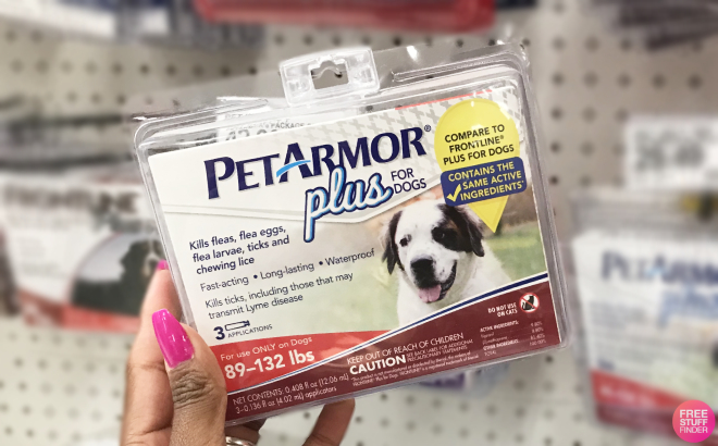 Hand Holding a PetArmor Plus Dogs Flea and Tick Prevention Treatment for Extra Large Dogs