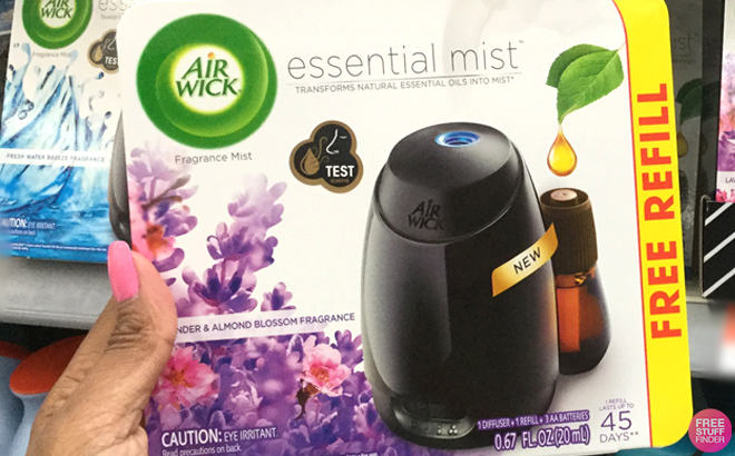 Hand Holding an Air Wick Essential Mist