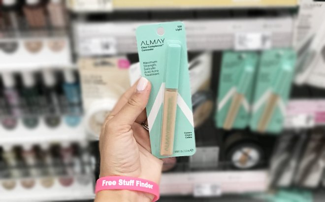 Hand Holding an Almay Clear Complexion Concealer