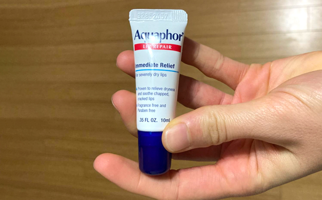Hand Holding an Aquaphor Lip Repair Ointment