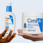 Hand holding CeraVe Moisturizer Cream and AM Lotion