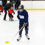 Kid playing Ice Hockey on USA Hockey Try Hockey FREE Day