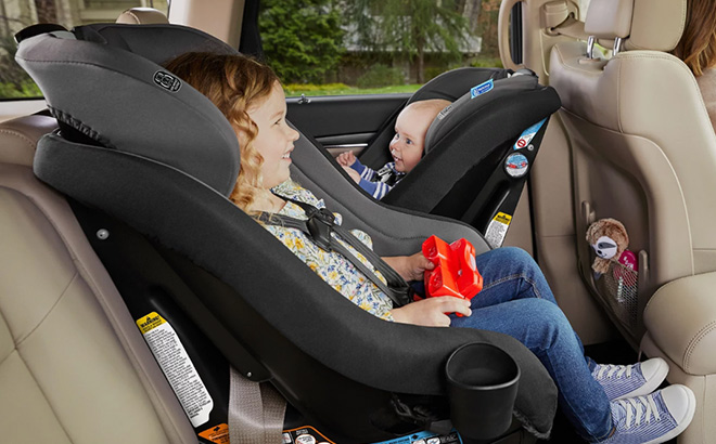 Kids are Sitting in a Contender GO Convertible Car Seat