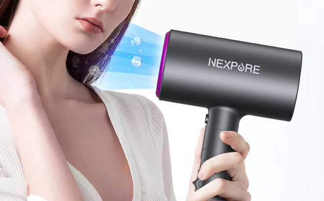 Lady Holding a Nexpure Professional Ionic Hairdryer