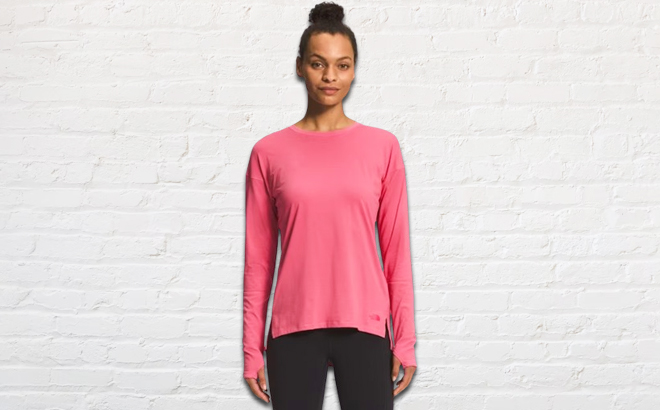 Lady wearing a pink The North Face Dawndream Womens Long Sleeve Shirt