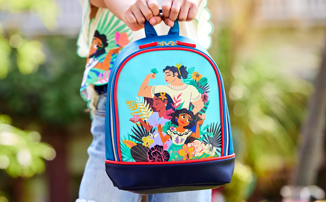 Little Girl Holding Disney Encanto Mini Backpack