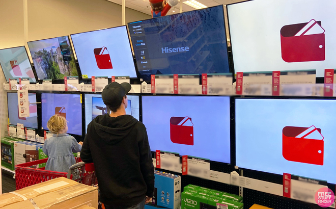 Man shopping for Hisense TV at Target