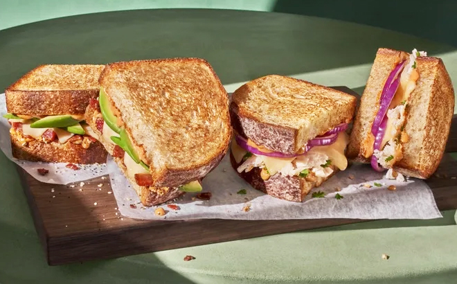Panera Breads Southwest Chicken Melt and Bacon Avocado Melt on a board