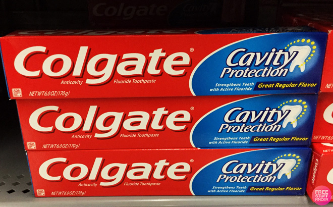Stack of Colgate Cavity Protection Toothpaste on a Shelf