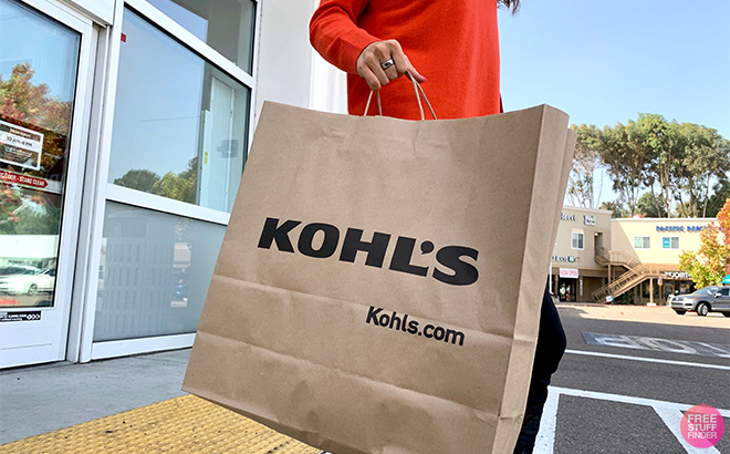 Tina Holding a Kohls Paper Bag While Leaving the Store