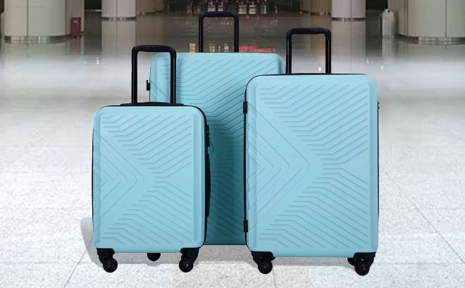 Travelhouse 3 Piece Spinner Luggage Set on the Airport Aisle