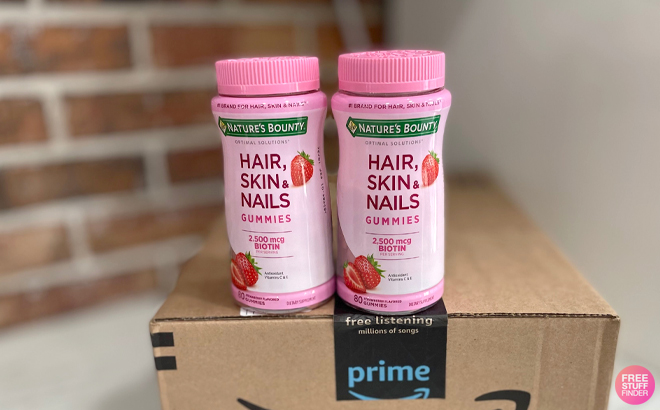 Two Bottles of Natures Bounty Hair Skin Nails Vitamin Gummies on Amazon Box