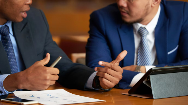 Two People Discussing Settlement Inside a Court