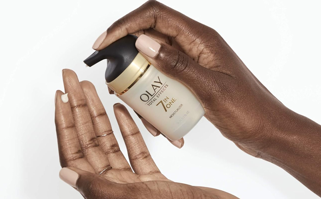 Woman Holding Olay Total Effects 7 In One Night Cream Woman Holding Olay Total Effects 7 In One Night Cream