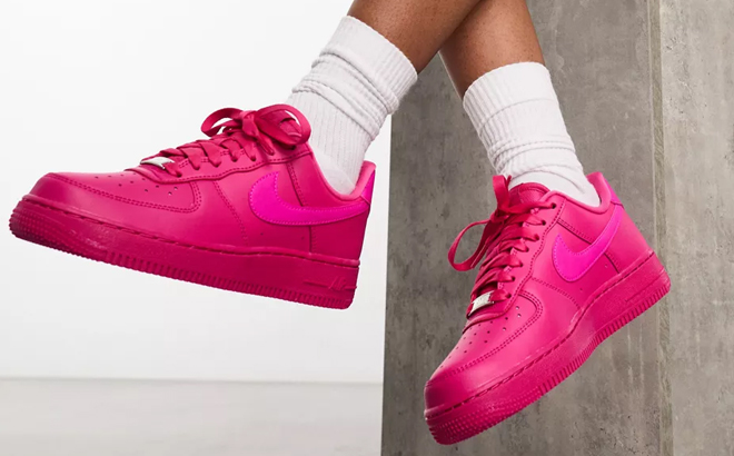 Woman Wearing Nike Air Force 1 07 Shoes in Hot Pink