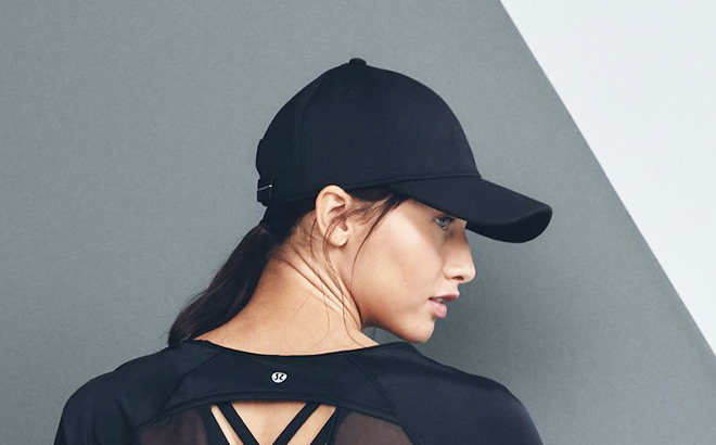 Woman Wearing a Lululemon Baller Hat Soft in Black