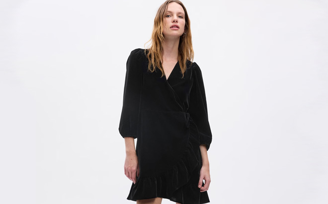 Woman is Wearing Gap Velvet Wrap Mini Dress in Black Color