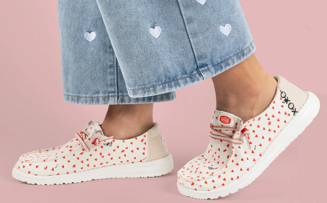Woman is Wearing Hey Dude Wendy Youth Hearts Valentines Day Shoes