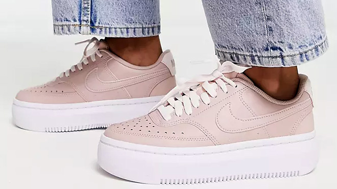 Women Wearing Nike Court Vintage Sneakers in Pink and White Women Wearing Nike Court Vintage Sneakers in Pink and White